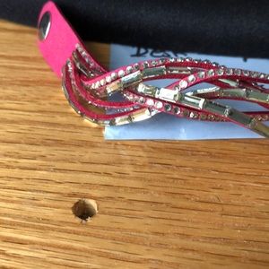 Paparazzi fuschia crisscross bracelet with different cz stones euc